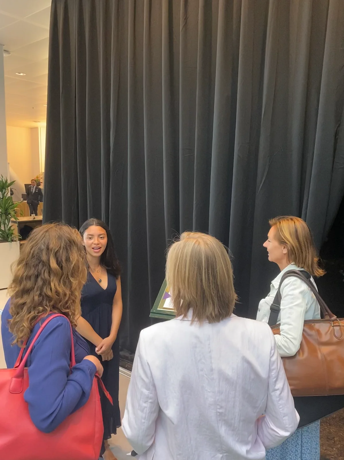 Talking to a group of women about the project